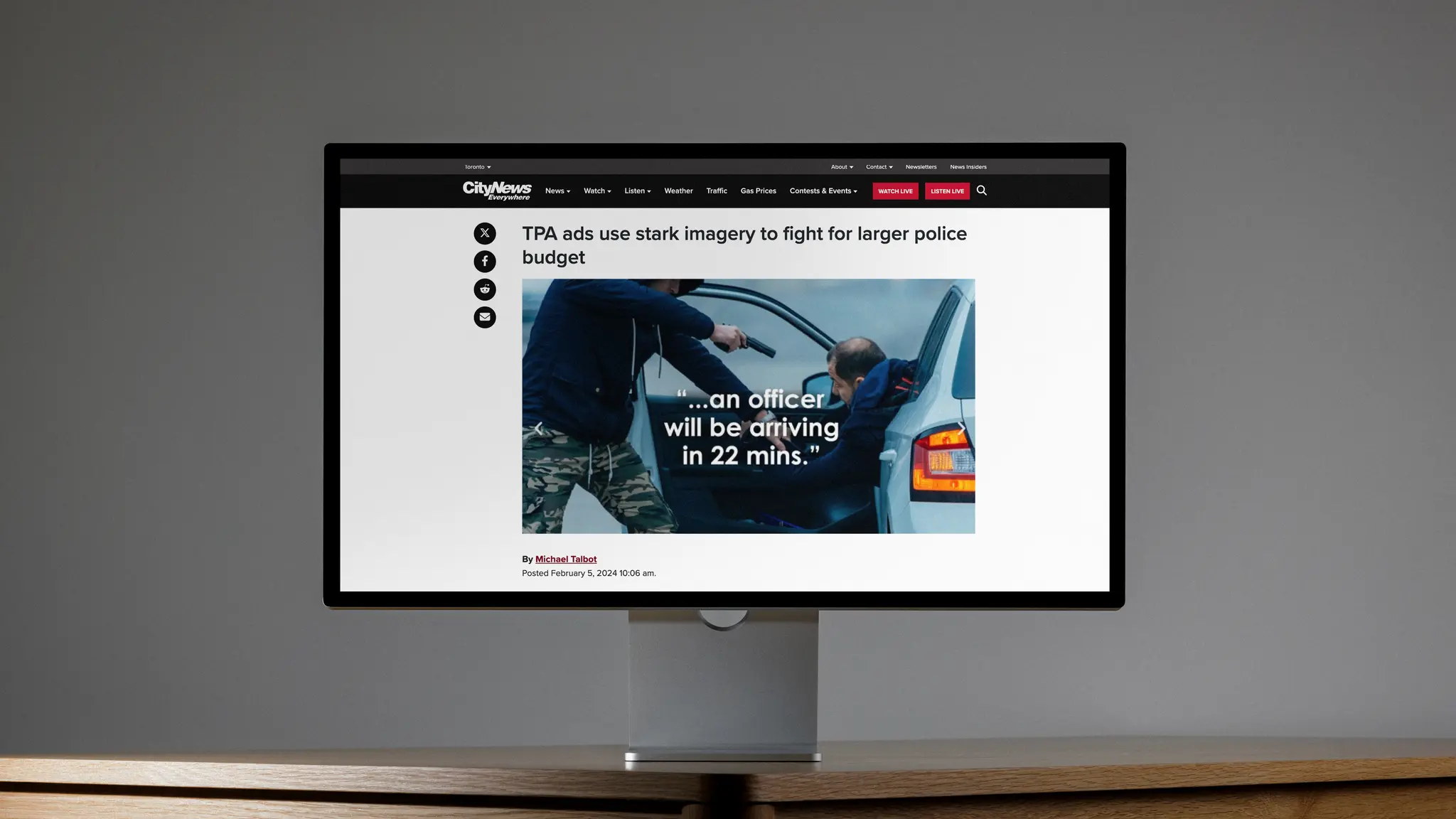 Desktop monitor showing Toronto Police Association Campaign